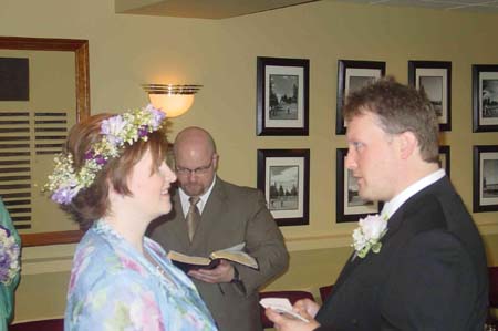 Mark reading his vows
